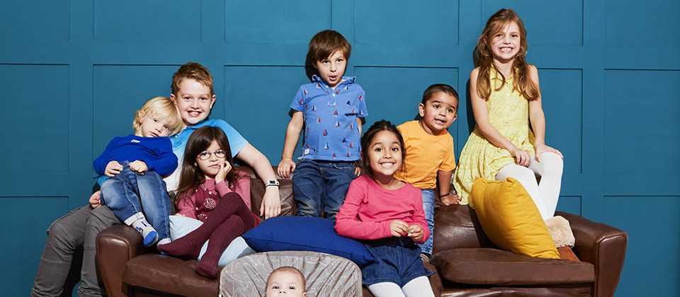 many kids on a sofa