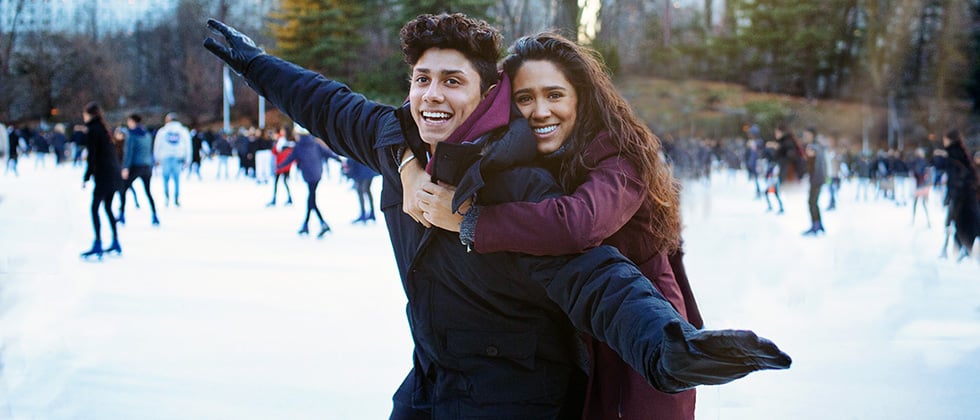 A young couple ice-skating on a first datea as example for first date ideas