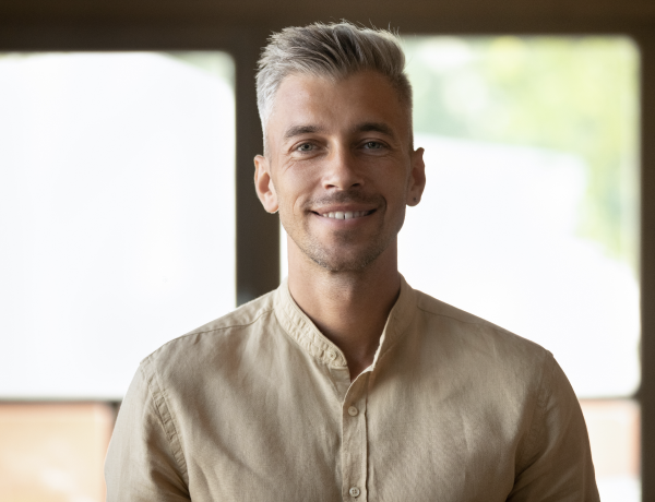 Men is smiling in camera as example who is on eharmony