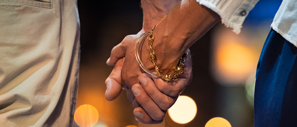 Close-up of a couple holding hands