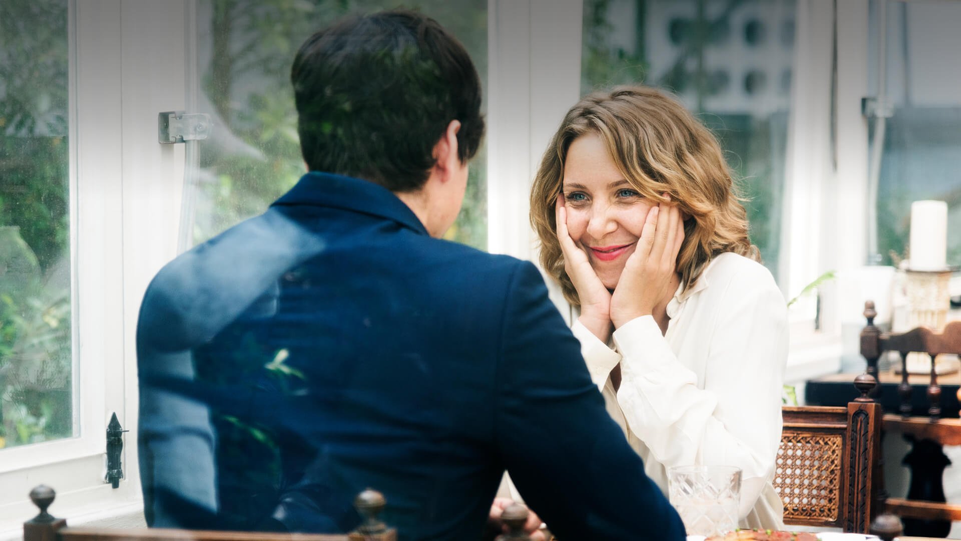 Christian dating sites symbolized by a man and a woman having a deep talk about their belief on a date in a cafe