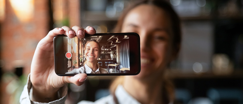 Women shows phone for eharmony features