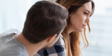 Couple having a deep and emotional talk & look upset