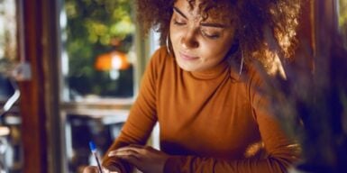 Woman sitting at a café thinking about 'Am I ready for a relationship?'