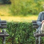 Man and woman sitting on the bench - she thinks about how to ask a guy out