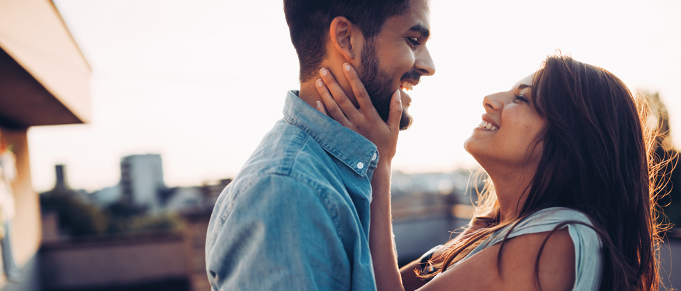Man and woman embrace as symbol of "what is love"