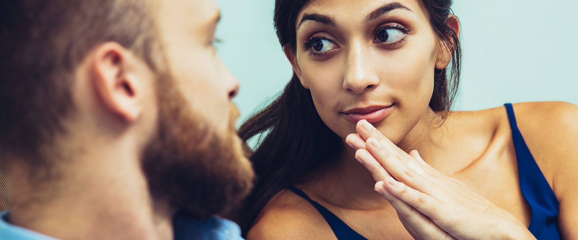 Woman looks man in the eye as an example of how to ask someone out