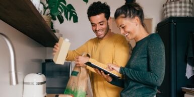 Man and woman cooking together as an example of how to get someone to open up