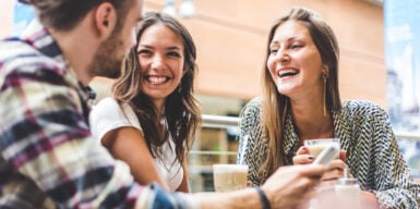 Multiracial group of friends having a coffee together