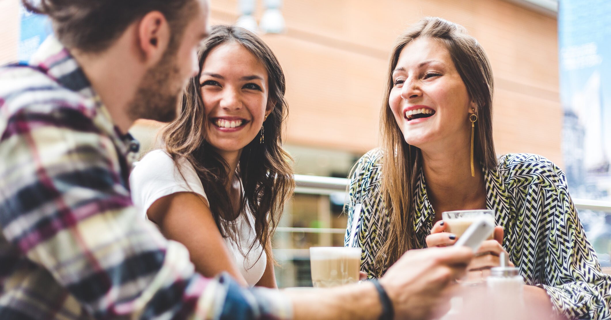 Multiracial group of friends having a coffee together