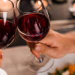 Couple on a dating cheering's with red wine