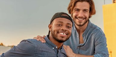 Two man smiling into the camera