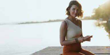 Woman on a phone similing